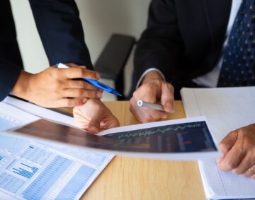 investor-broker-discussing-trading-strategy-holding-papers-with-financial-charts-pens-cropped-shot-broker-job-investment-concept (2)